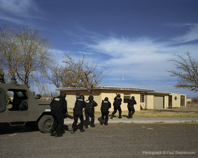 SWAT team approaches house
