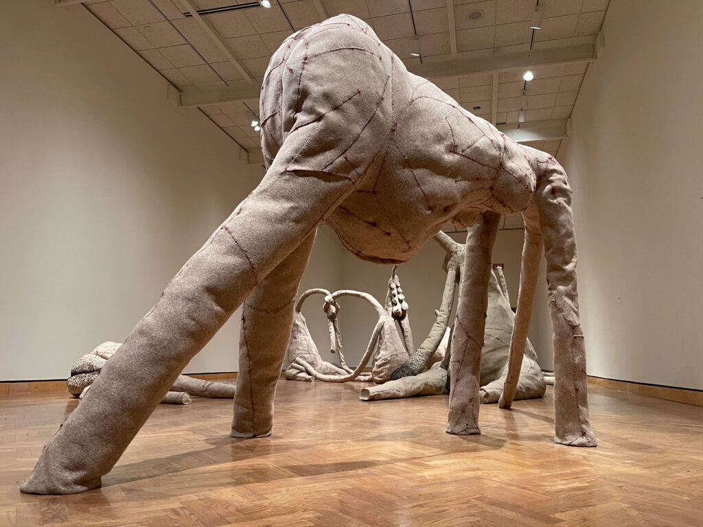 Gray felt sculpture on all fours