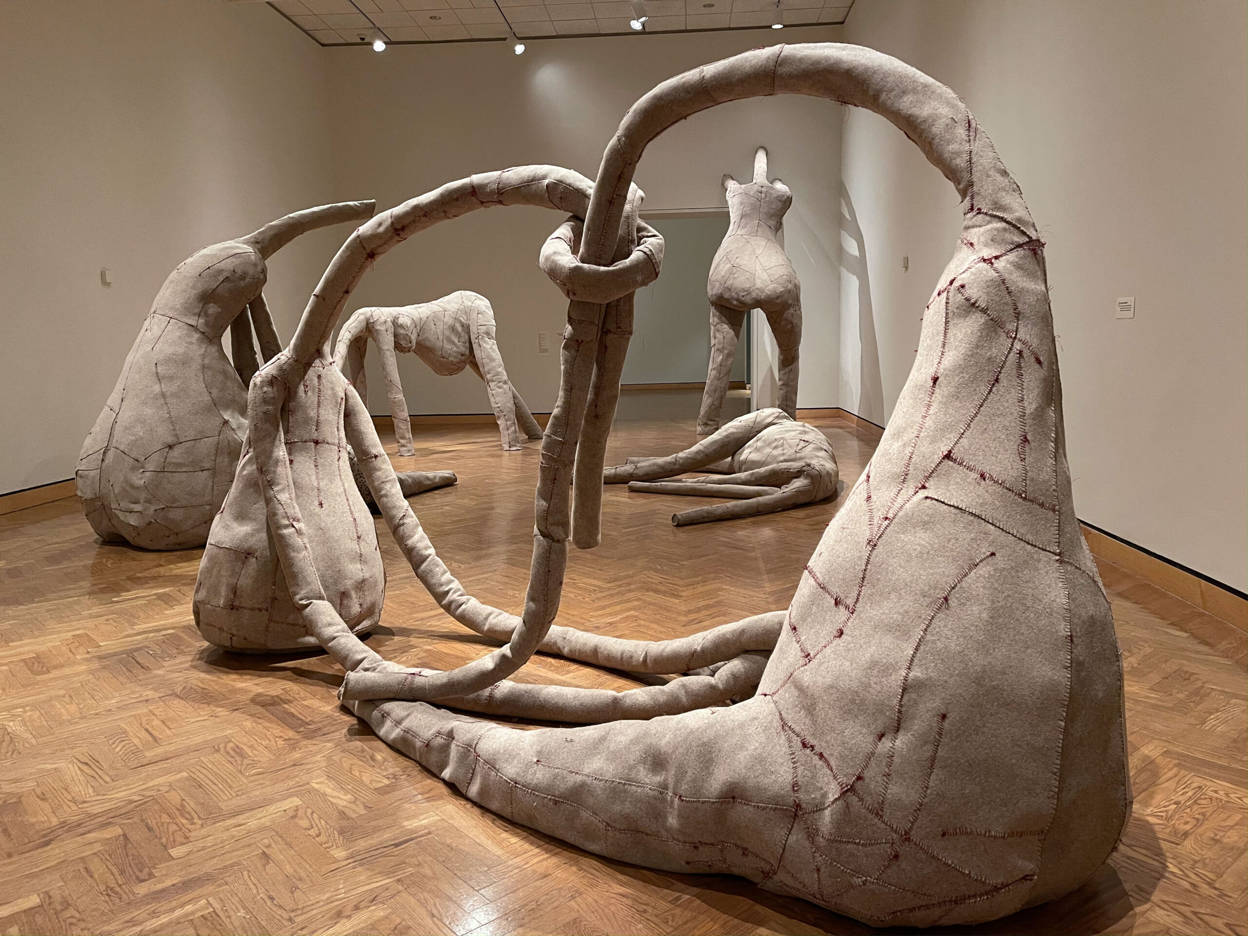 Group of gray felt figurative sculptures