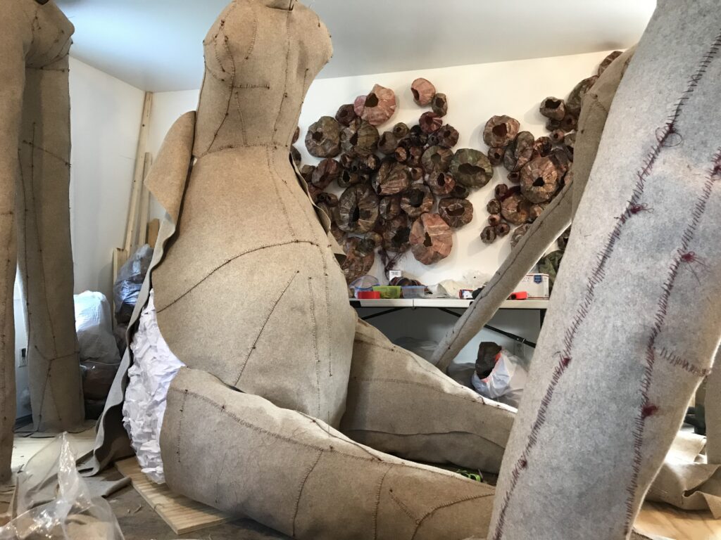 Felt sculptures in crowded studio