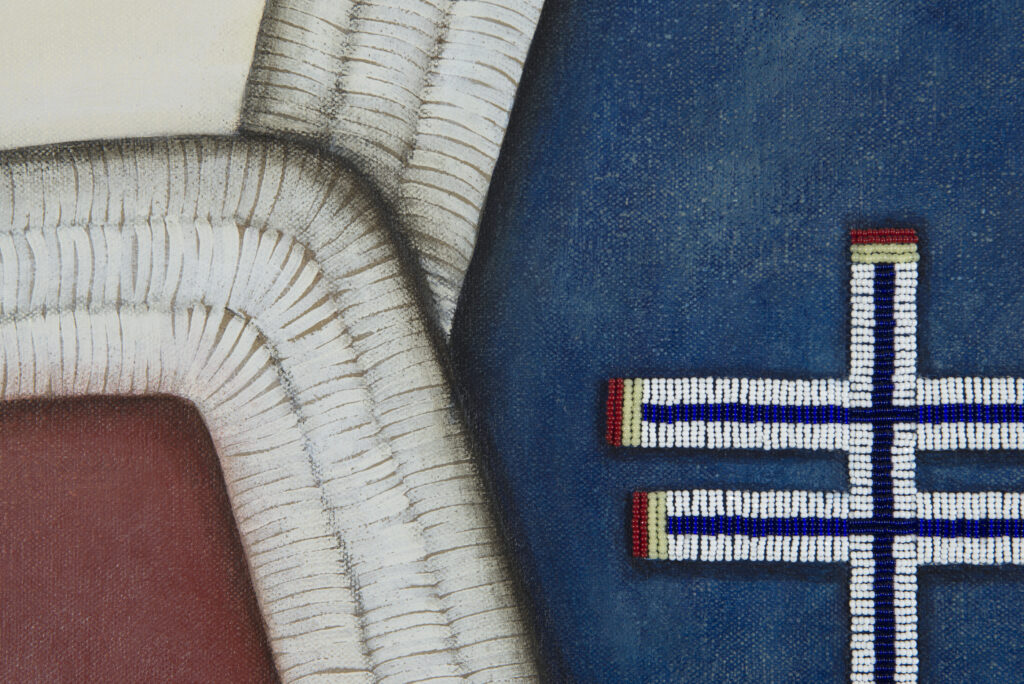 Detail view of red, blue, and white moccasins.