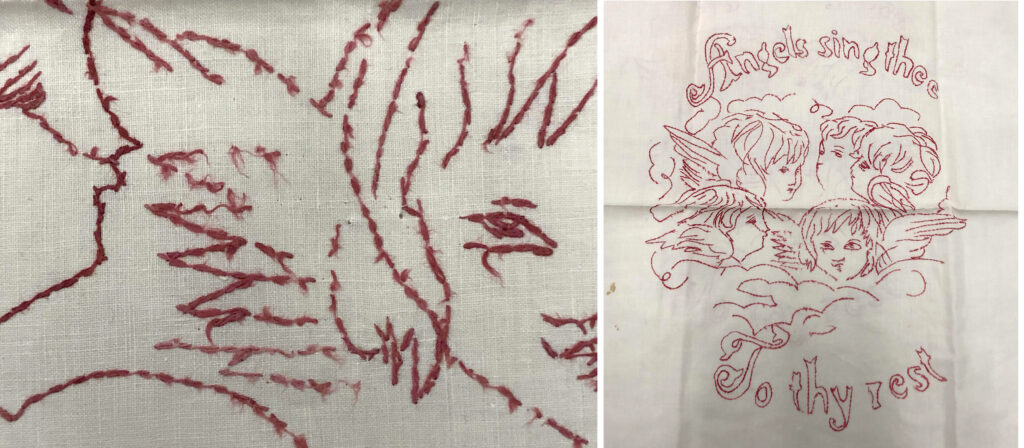 Detail of red embroidery thread, with face and wing of angel /Off-white vintage textile with four angels embroidered in red thread. Embroidered text reads: "Angels sing thee / To thy rest."