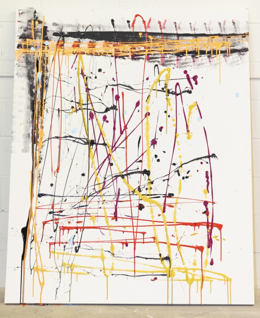 White canvas with multicolored paint splatters, mostly vertical and horizontal.