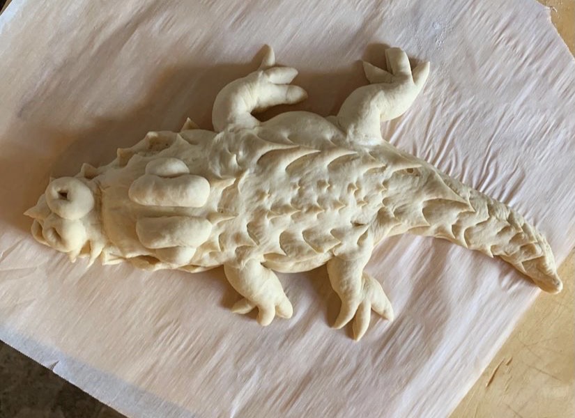 Bread dough in the shape of an alligator.