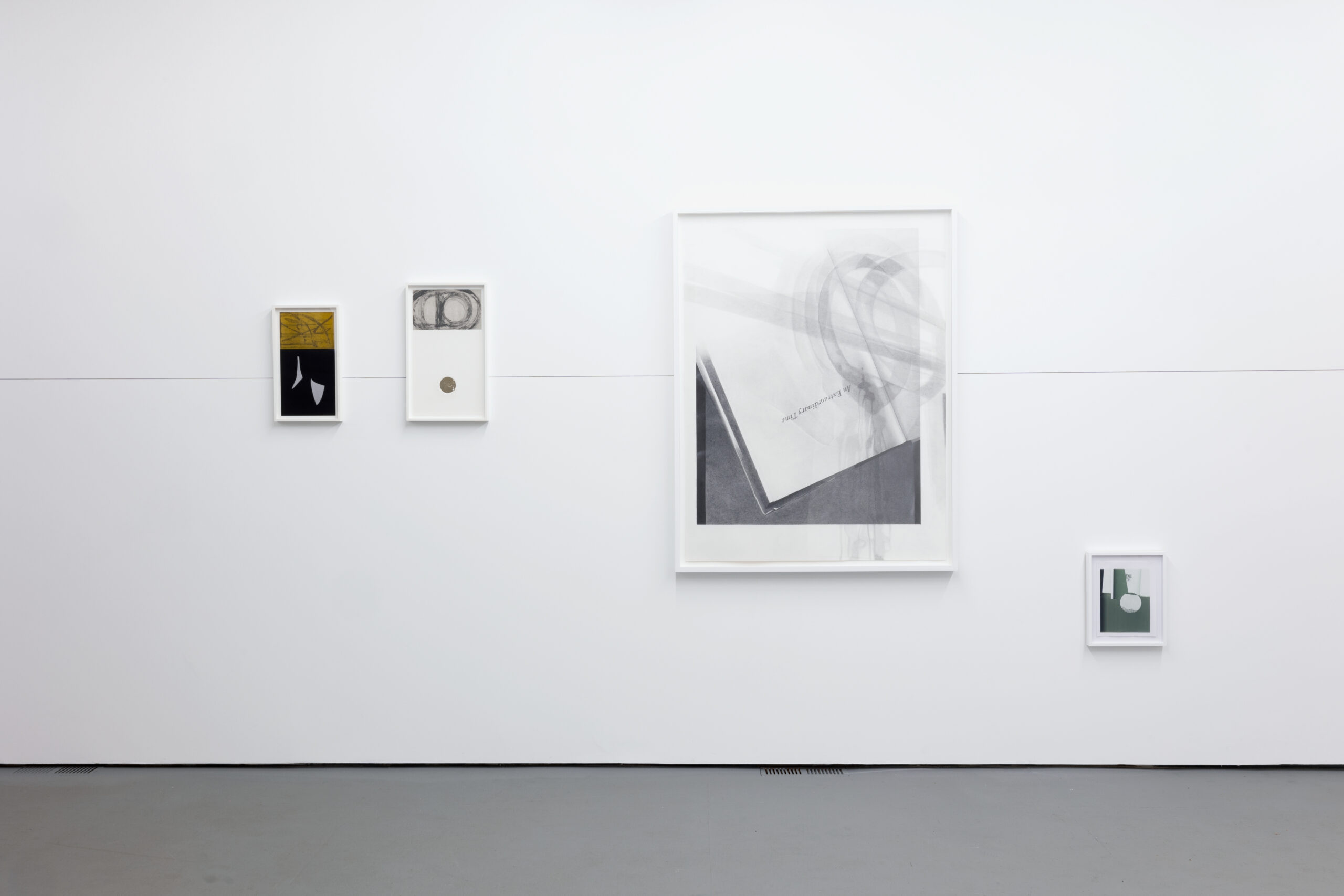 Four artworks in muted colors and various sizes arranged on a white gallery wall.