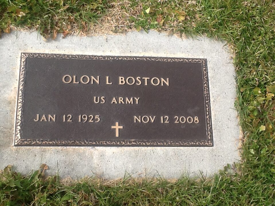 Grave marker set into ground reads: Olon L Boston, US Army, Jan 12 1925, Nov 12 2008, with cross symbol.