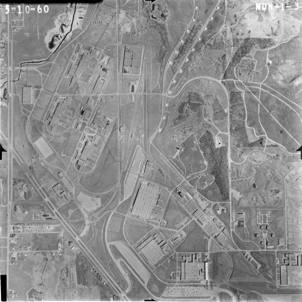 Black and white aerial map with parcels of land and empty space in center.