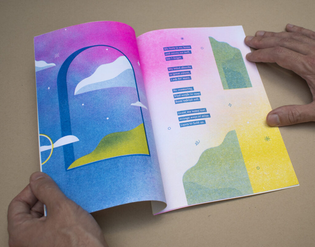 Hands open printed book with multicolored illustrations.