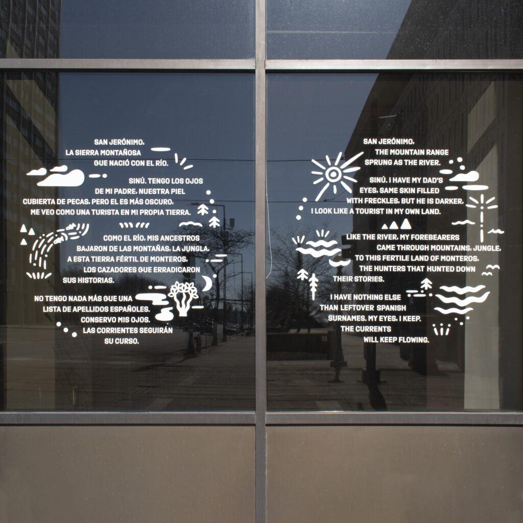 Decal on window with white text and small images in two circular shapes.