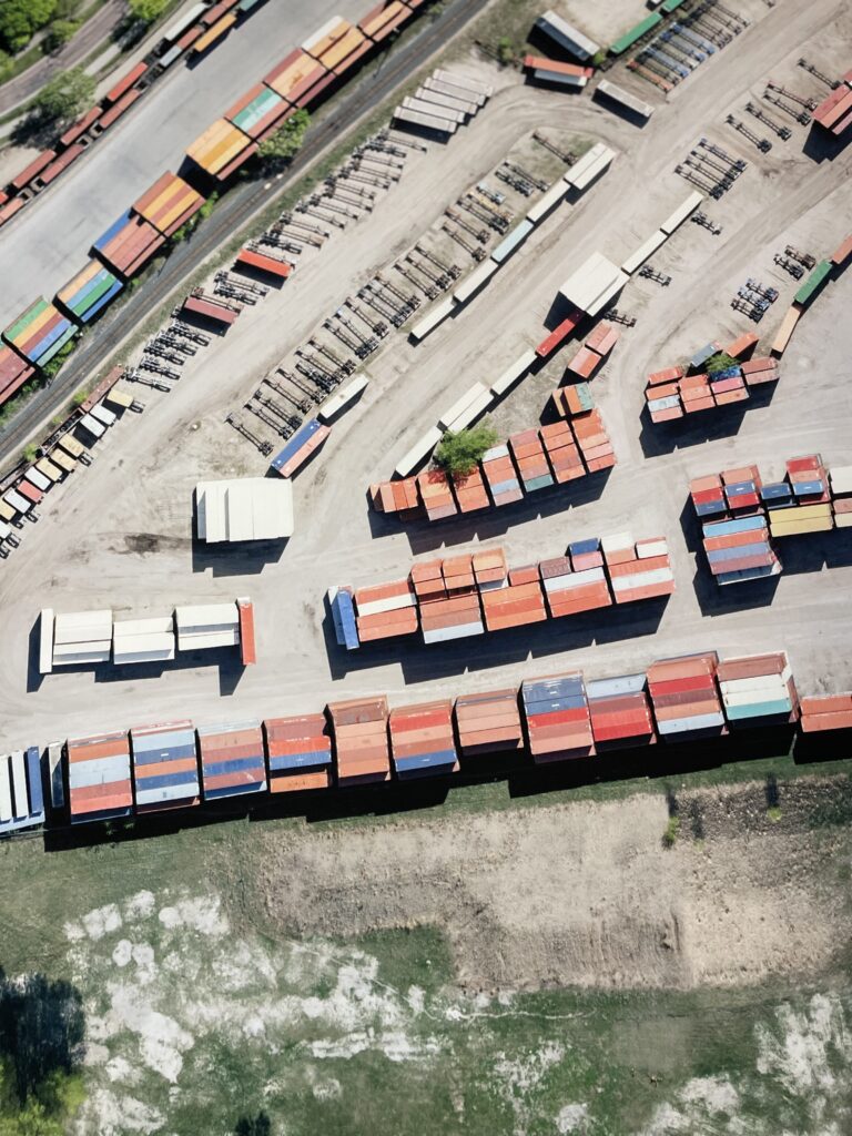 Aerial view of train yard with colorful freight containers