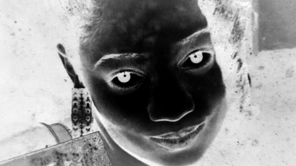 Black and white negative of person's face