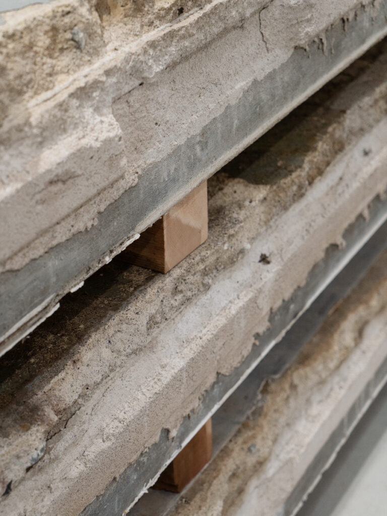 Layered concrete stacked with cedar board in between.